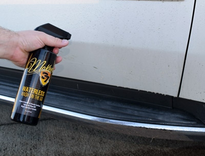 Spray waterless wash directly onto the panel