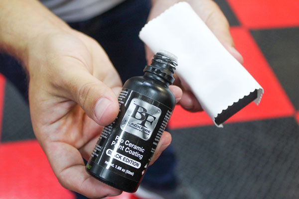 After you've prepped your paint surface, put 3-5 drops of BLACKFIRE Pro Ceramic Paint Coating Black Edition on to a coating applicator.