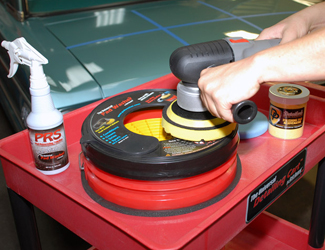 Drying a pad on the Grit Guard Universal Pad Washer on the Universal Detailing Cart.