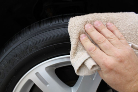 Pat off excess tire gel with a towel that you only use for tires.