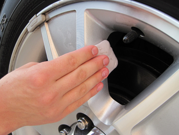 Use detailing clay to remove embedded particles from alloy wheels.