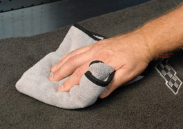 Use a microfiber towel to agitate the carpet and soak up the clear and dirt.