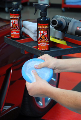 Thoroughly work Wolfgang Pad Werks Polishing Pad Cleaner into the pad and rinse it with water when finished cleaning