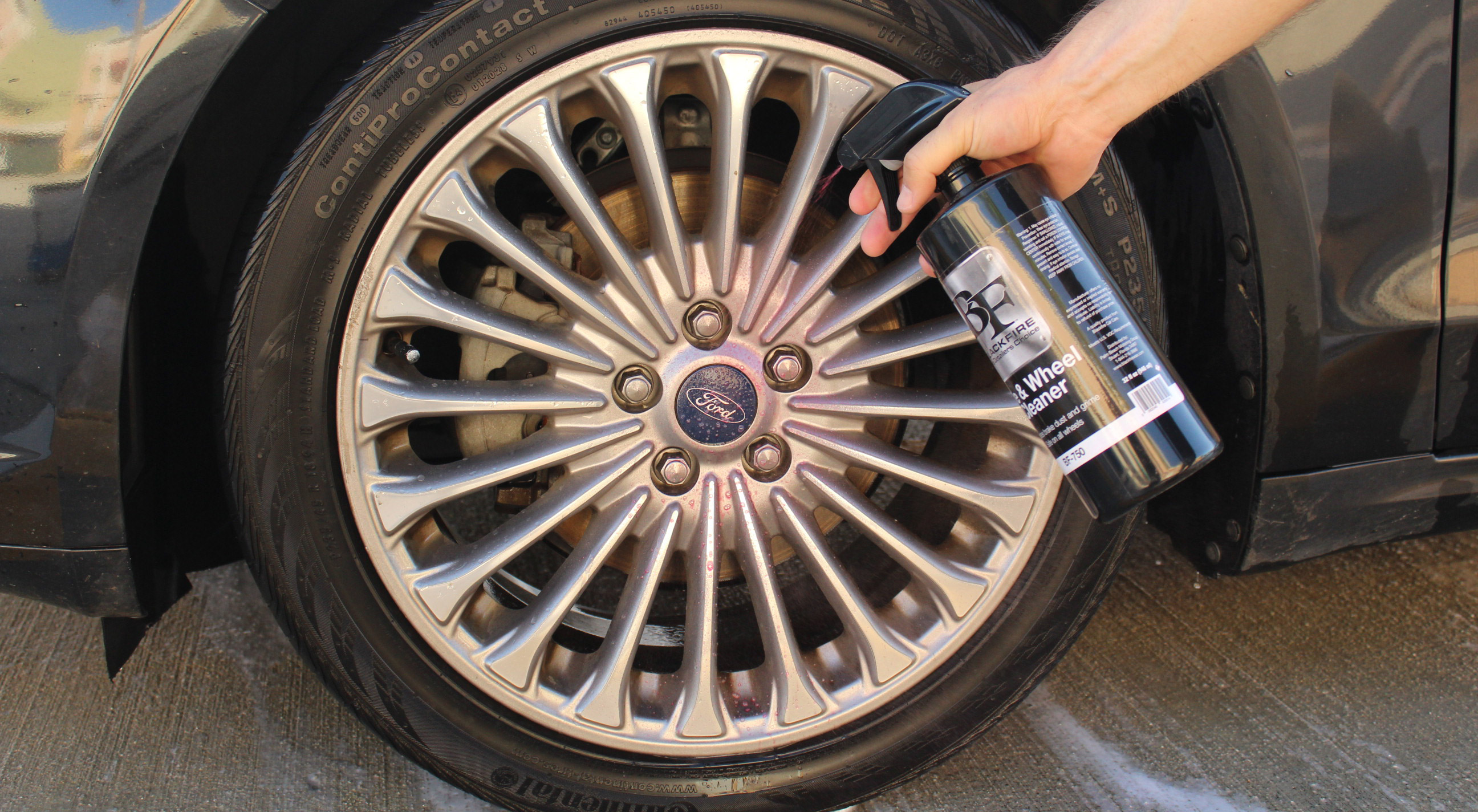 We are going to spray a GENEROUS amount of our BLACKFIRE Tire & Wheel cleaner all over the surface of the tires and rims.